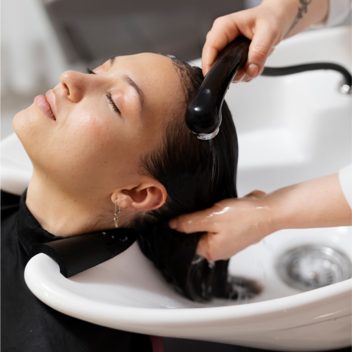 woman-getting-treatment-hairdresser-shop 1